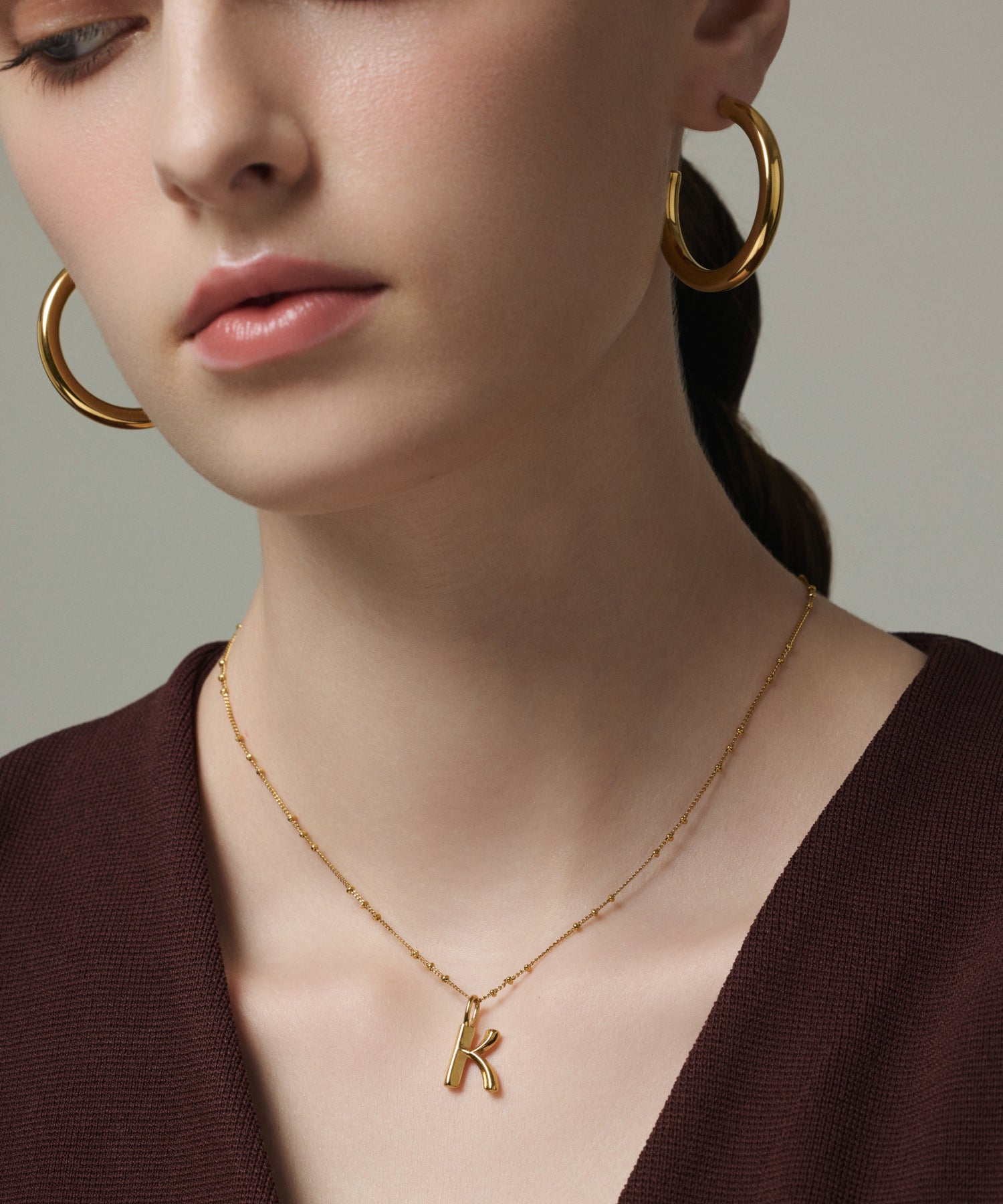 ゴールド オリジナルイニシャルチャーム(K) 金属アレルギー対応 サージカルステンレス