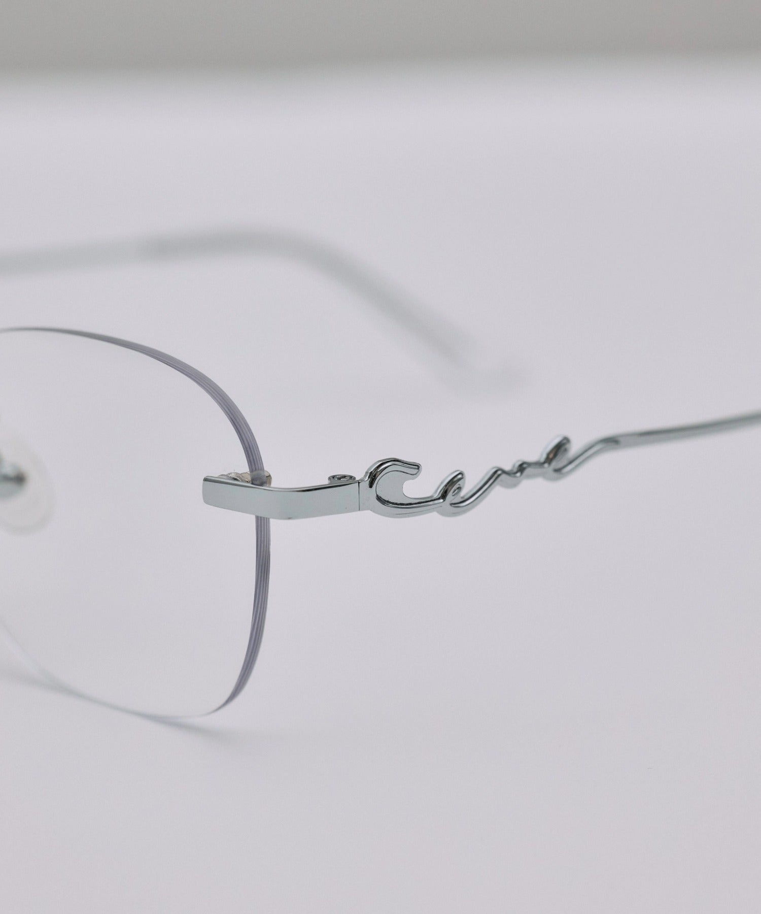 [クリア]テンプルロゴリムレスアイウェア