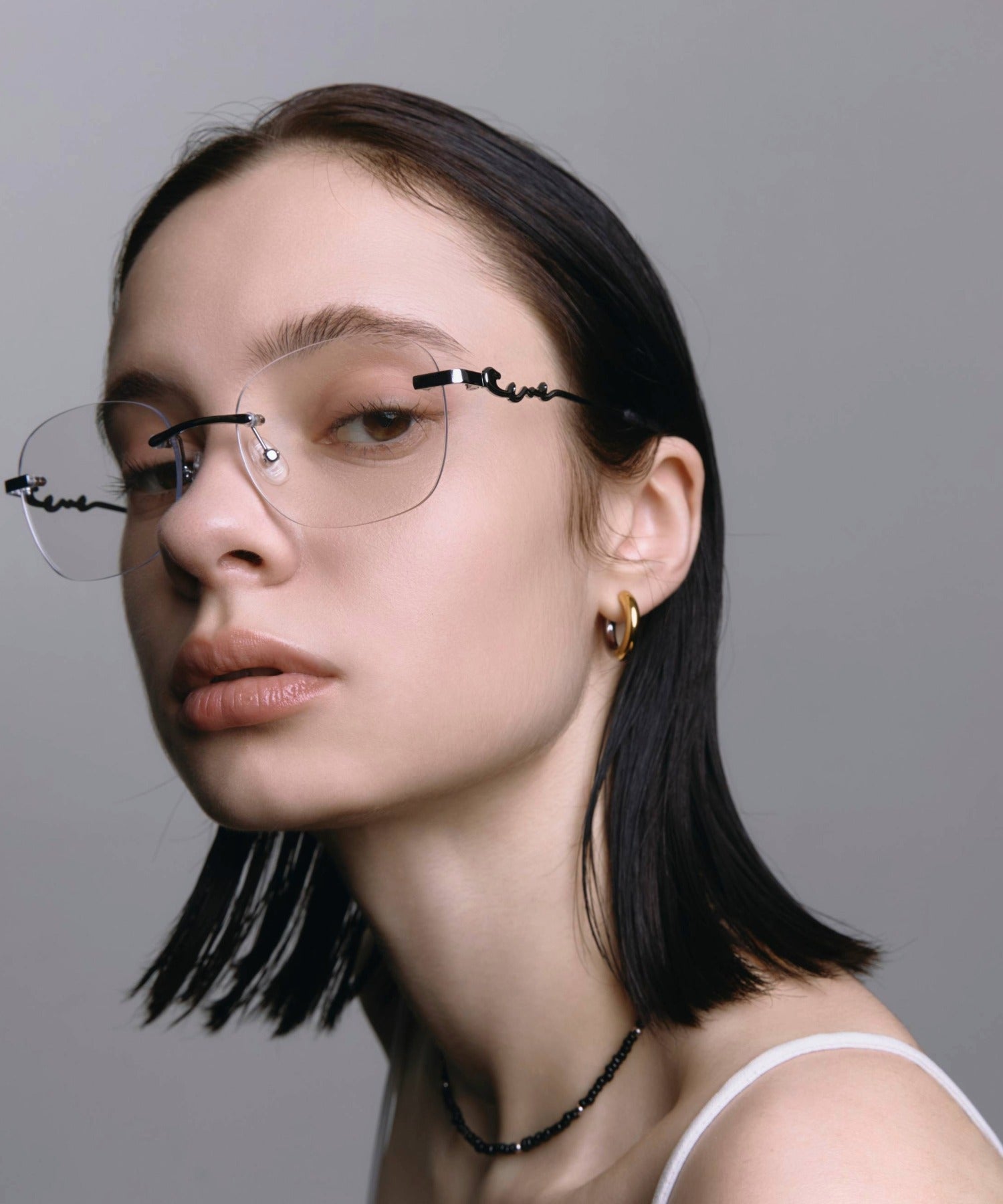 [クリア]テンプルロゴリムレスアイウェア